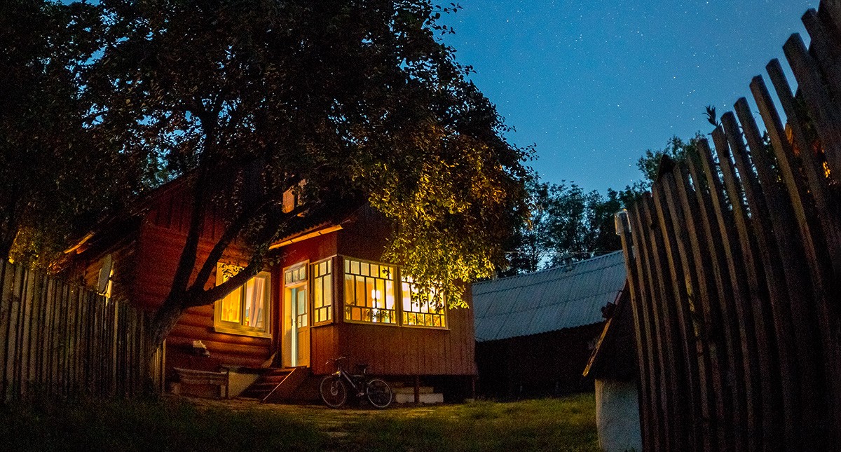 woman thinking while holding debit card